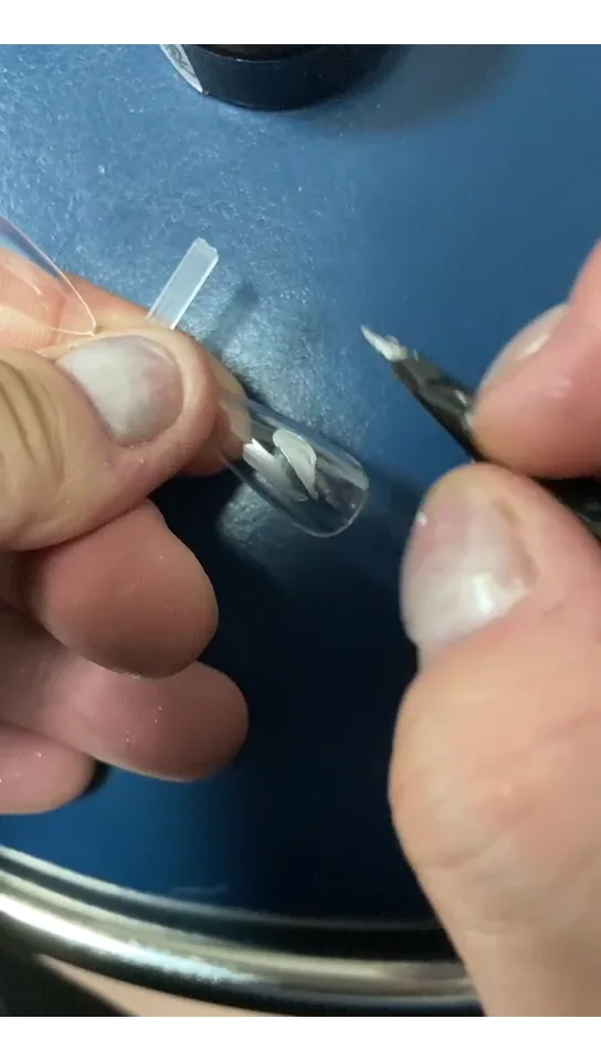 Mirror silver painting gel used for raised linework on a clear nail tip